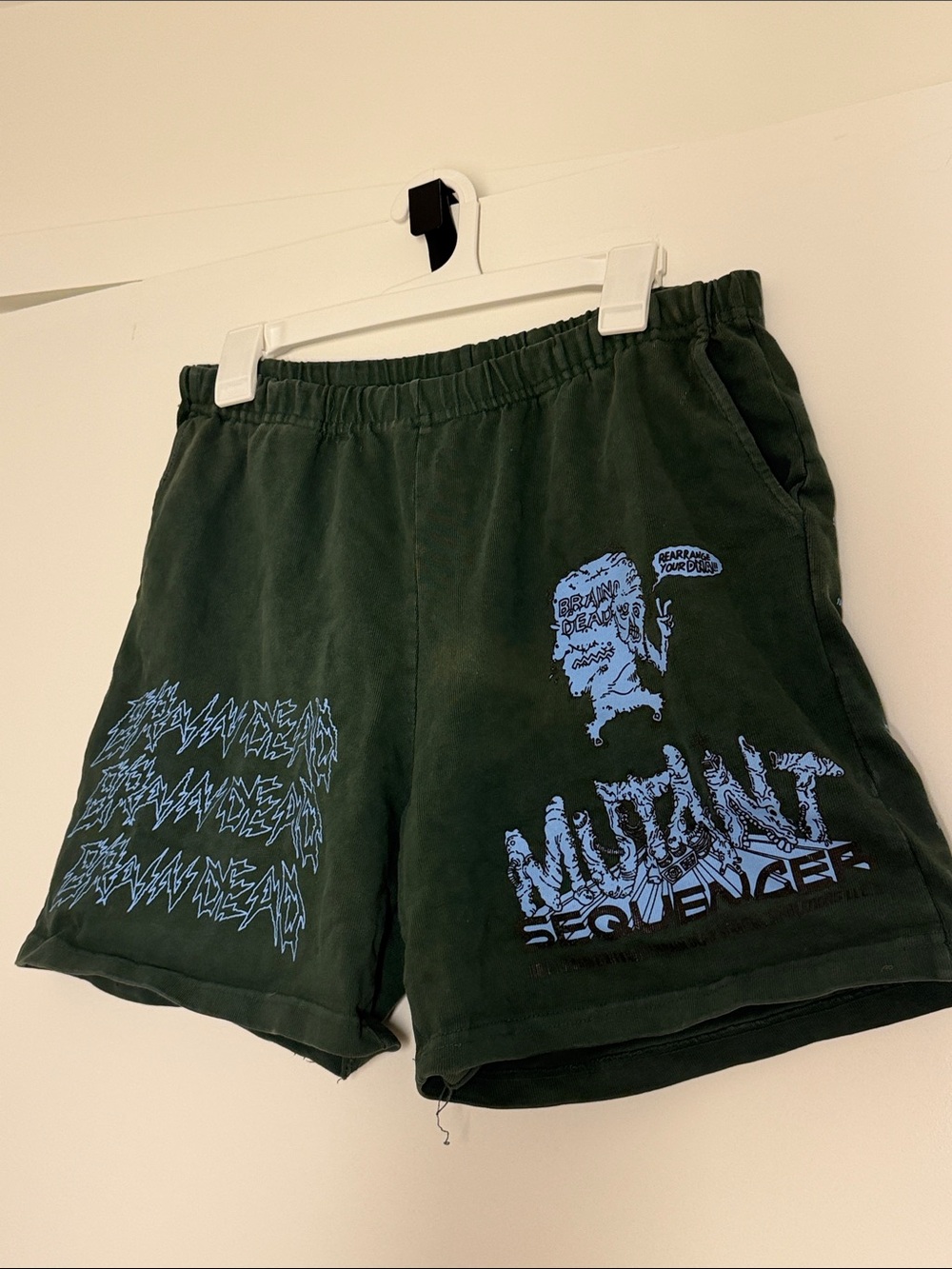 Brain Dead Dark Green Athletic Shorts with Light Blue 'Mutant Sequence' Print